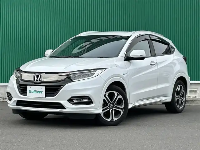 ホンダ ヴェゼル ハイブリッド Z ホンダセンシング 宮城県 2019(令1)年 9.9万km プラチナホワイトパール ワンオーナー/ホンダセンシング/●衝突軽減ブレーキ〈CMBS〉/●誤発進抑制機能/●歩行者事故低減ステアリング/●路外逸脱抑制機能/●ACC〈アダプティブ・クルーズ・コントロール〉/●LKAS〈車線維持支援システム〉/●先行車発進お知らせ機能/●標識認識機能/コンフォートビューパッケージ/●親水/ヒーテッドドアミラー/●フロントドア撥水ガラス/●熱線入りフロントウインドウ/純正SDナビ/・Bluetooth/・フルセグTV/・CD/DVD/バックカメラ/ドライブレコーダー/ETC/ハーフレザーシート/運転席・助手席シートヒーター/チップアップシート/革巻きステアリング/ステアリングスイッチ/LEDヘッドランプ/オートライト/電子制御パーキングブレーキ/オートブレーキホールド機能/プッシュスタート＆スペアキー/ルーフレール/純正17AW/ドアバイザー/W/サイド/カーテンエアバッグ/取扱説明書/保証書
