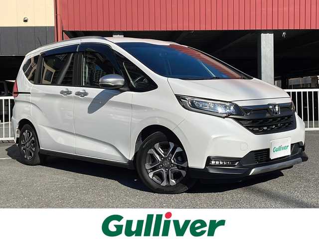 ホンダ フリード＋ クロスター ホンダセンシング 神奈川県 2021(令3)年 2.3万km プラチナホワイトパール ワンオーナー			/社外8インチナビ【AVIC-RL720】/・DTV/DVD/CD/Bluetooth/SD/バックカメラ/リアコーナーセンサー/ホンダセンシング/・衝突軽減ブレーキ			/・誤発進抑制機能					/・路外逸脱抑制機能			/アダプティブクルーズコントロール			/アイドリングストップ					/ビルトインETC			/前側ドライブレコーダー			/ルーフレール/純正15インチAW/プッシュEgスタート/ストップ/スマートキー×2/オートライト		/LEDヘッドライト/フォグランプ/ターンランプ付電動格納ドアミラー/ドアバイザー/純正フロアマット			/取扱説明書/ナビ取扱説明書/新車時保証書