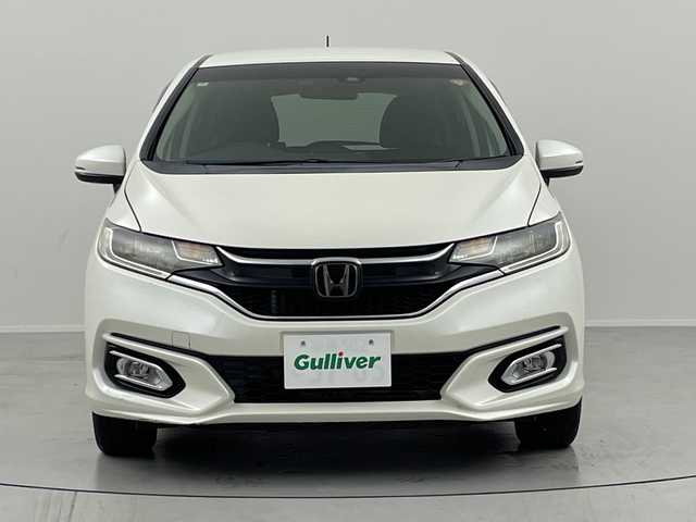 ホンダ フィット 13G L ホンダセンシング 福島県 2017(平29)年 10.5万km プレミアムホワイトパールⅡ /禁煙車//レーダークルーズコントロール//純正ナビ/フルセグＴＶ　/ＵＳＢ/BT//バックカメラ//ビルトインＥＴＣ//ドライブレコーダー//レーンアシスト//アルミ付きスタッドレス積込//ＬＥＤライト//ステアリングリモコン//レーンアシスト//オートハイビーム//フォグライト