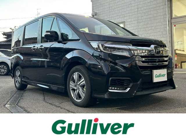 ホンダ ステップワゴン スパーダ ハイブリッド G EX ホンダセンシング 愛知県 2017(平29)年 4.9万km プレミアムスパークルブラックパール 純正メモリナビ/（AM/FM/CD/DVD/SD/BT/USB/HDMI）/フルセグTV/全方位カメラ/両側電動スライドドア/ハーフレザーシート/前席シートヒーター/純正フリップダウンモニター/ETC/ホンダセンシング/電動パーキングブレーキ/オートホールド機能/リアサンシェード/ウインカーミラー/LEDヘッドライト/純正フロアマット/スマートキー×2