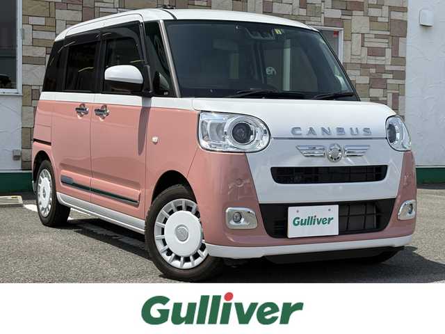 ダイハツ ムーヴ キャンバス ストライプス G 徳島県 2023(令5)年 1.3万km シャイニングホワイトパール/アプリコットピンクメタリック 純正ディスプレイオーディオ/（HDMI/TV/ラジオ/Apple CarPlay/AndroidAuto）/フルセグTV/ETC/前後ドラレコ/バックカメラ/プッシュスタート/スマートキー/ブレーキホールド/電動パーキング/ホットカップホルダー/両側パワースライドドア/スペアキー/LEDヘッドライト/LEDフォグライト/衝突被害軽減システム