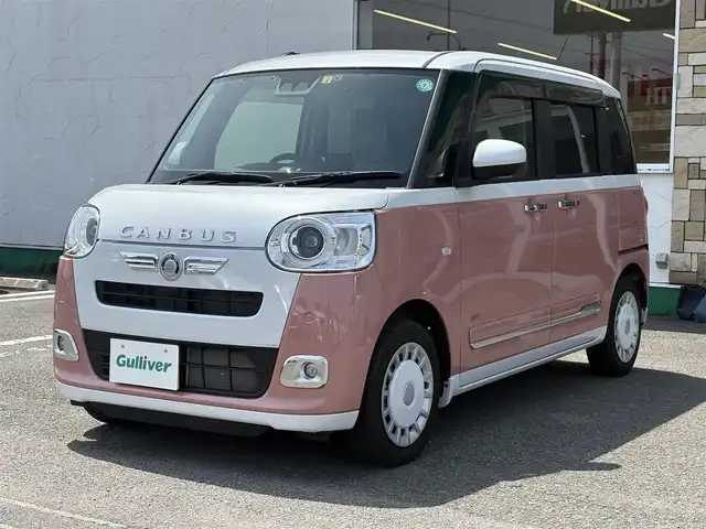 ダイハツ ムーヴ キャンバス ストライプス G 徳島県 2023(令5)年 1.3万km シャイニングホワイトパール/アプリコットピンクメタリック 純正ディスプレイオーディオ/（HDMI/TV/ラジオ/Apple CarPlay/AndroidAuto）/フルセグTV/ETC/前後ドラレコ/バックカメラ/プッシュスタート/スマートキー/ブレーキホールド/電動パーキング/ホットカップホルダー/両側パワースライドドア/スペアキー/LEDヘッドライト/LEDフォグライト/衝突被害軽減システム