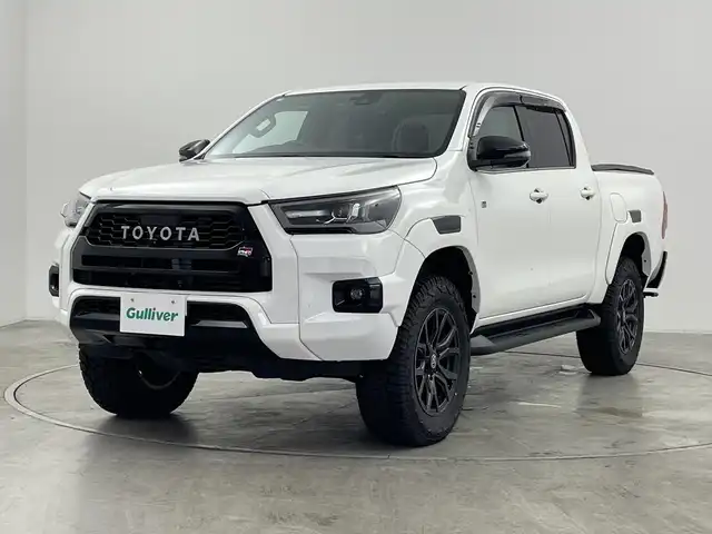 トヨタ ハイラックス Z GRスポーツ 群馬県 2022(令4)年 3.7万km スーパーホワイトⅡ ・純正８インチディスプレイオーディオ/・バックカメラ/・パノラミックビュー/・ダウンヒルアシストコントロール/・レーダークルーズコントロール/・ドライブレコーダー/・パドルシフト/・パワーシート/・ETC/・レーンアシスト/・LDA/・横滑り防止装置/・盗難防止装置/・衝突被害軽減システム/・プッシュスタート/・純正フロアマット/・ハーフレザーシート/・純正１８インチアルミホイール/・LEDヘッドライト/・プリクラッシュセーフティ