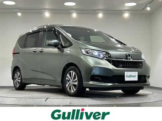 ホンダ フリード ハイブリット G 愛知県 2023(令5)年 3.9万km シルバーミストグリーンM 純正ナビ【VXM-234VFi】/両側パワースライドドア/衝突軽減ブレーキ/レーダークルーズコントロール/車線逸脱警報/クリアランスソナー/ハーフレザー/バックカメラ/ビルトインＥＴＣ/アクセサリーソケット/IＳＯＦＩＸ/LEDヘッドライト/純正フロアマット/純正１５インチアルミホイール