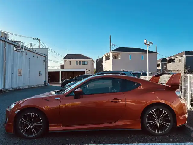 トヨタ ８６ GT 静岡県 2012(平24)年 9.5万km オレンジメタリック ユーザー買取車両/純正HDDナビ（NHZA-W61G）/【AM/FM/CD/BT/TV】/純正17インチAW/MTモード付AT/パドルシフト/スマートキー/エンジンスタートボタン/バックカメラ/ETC/レザーシート/純正エアロパーツ（フロント、サイド、リア）/横滑り防止装置/ドライブレコーダー/保証書/取扱説明書