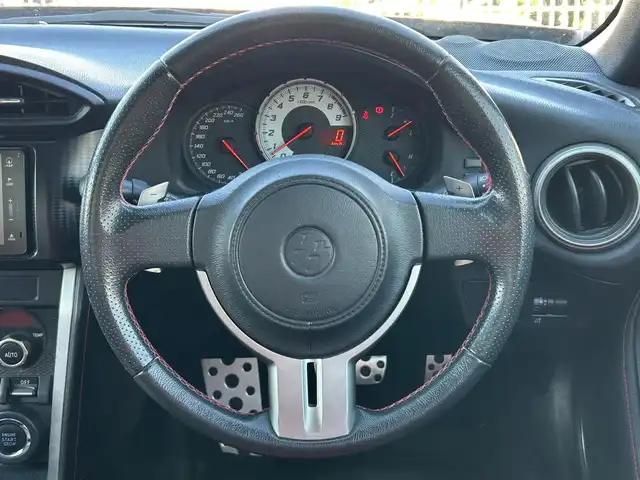 トヨタ ８６ GT 静岡県 2012(平24)年 9.5万km オレンジメタリック ユーザー買取車両/純正HDDナビ（NHZA-W61G）/【AM/FM/CD/BT/TV】/純正17インチAW/MTモード付AT/パドルシフト/スマートキー/エンジンスタートボタン/バックカメラ/ETC/レザーシート/純正エアロパーツ（フロント、サイド、リア）/横滑り防止装置/ドライブレコーダー/保証書/取扱説明書