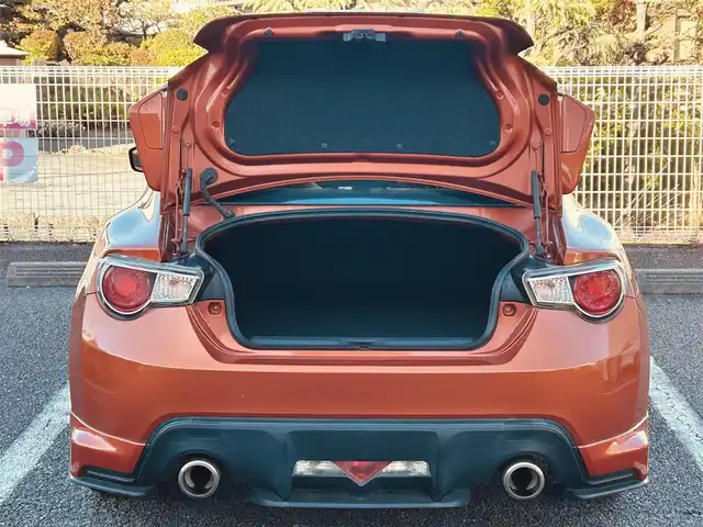 トヨタ ８６ GT 静岡県 2012(平24)年 9.5万km オレンジメタリック ユーザー買取車両/純正HDDナビ（NHZA-W61G）/【AM/FM/CD/BT/TV】/純正17インチAW/MTモード付AT/パドルシフト/スマートキー/エンジンスタートボタン/バックカメラ/ETC/レザーシート/純正エアロパーツ（フロント、サイド、リア）/横滑り防止装置/ドライブレコーダー/保証書/取扱説明書