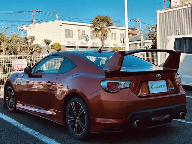 トヨタ ８６ GT 静岡県 2012(平24)年 9.5万km オレンジメタリック ユーザー買取車両/純正HDDナビ（NHZA-W61G）/【AM/FM/CD/BT/TV】/純正17インチAW/MTモード付AT/パドルシフト/スマートキー/エンジンスタートボタン/バックカメラ/ETC/レザーシート/純正エアロパーツ（フロント、サイド、リア）/横滑り防止装置/ドライブレコーダー/保証書/取扱説明書