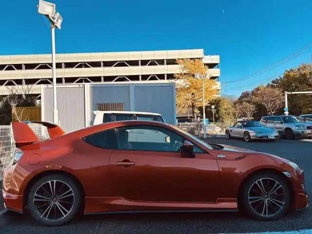 トヨタ ８６ GT 静岡県 2012(平24)年 9.5万km オレンジメタリック ユーザー買取車両/純正HDDナビ（NHZA-W61G）/【AM/FM/CD/BT/TV】/純正17インチAW/MTモード付AT/パドルシフト/スマートキー/エンジンスタートボタン/バックカメラ/ETC/レザーシート/純正エアロパーツ（フロント、サイド、リア）/横滑り防止装置/ドライブレコーダー/保証書/取扱説明書