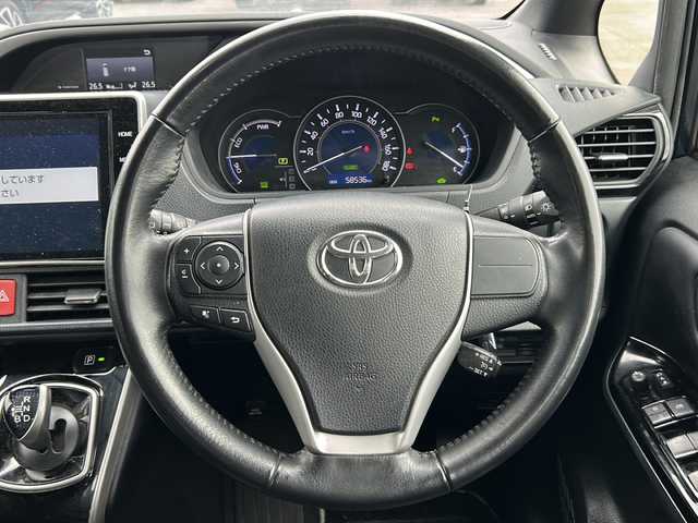 トヨタ ヴォクシー ハイブリッド ZS 煌Ⅲ 岐阜県 2021(令3)年 5.9万km ブラッキッシュアゲハガラスフレーク 登録時走行距離58535km/純正10インチナビ/バックモニター/後席モニター/フルセグテレビ/12インチ後席モニター/シートヒーター/クルーズコントロール/両側パワースライドドア/ETC2.0/フォグランプ/純正アルミホイール/オートライト/オートマチックハイビーム/レーンキープアシスト/LEDヘッドライト/純正フロアマット/スマートキー/プッシュスタート/ドアバイザー/禁煙車