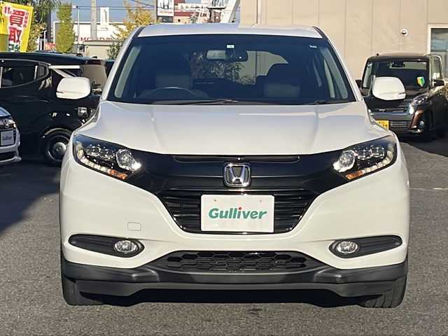 ホンダ ヴェゼル 愛知県 2016(平28)年 5.1万km ホワイトオーキッドパール /ワンオーナー//禁煙車//Bluetooth・FM・AM・//フルセグテレビ//純正ディーラーナビ//バックカメラ//後席会話サポート//クルーズコントロール//ETC//保証書//取扱説明書//記録簿//スペアキー（1本）//スマートキー//電動格納ミラー//オートライト//ハロゲンフォグランプ//純正16インチアルミホイール//ABS//TCS//横滑り防止//Gマット//ISOFIX//ブレーキホールド//ブレーキアシスト//衝突安全ボディー//EBD//盗難防止システム//UVカットガラス//プライバシーガラス//プッシュスタート//革巻きステアリング