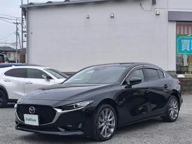 マツダ マツダ３セダン 15S ツーリング 熊本県 2021(令3)年 2万km ジェットブラックマイカ ワンオーナー/純正ナビ/【フルセグTV/CD/DVD/USB/BT/HDMI】/バックカメラ/i-ACTIVSENSE/スマートブレーキサポート/車線逸脱警報/コーナーセンサー/ブラインドスポットモニター/ステアリングリモコン/LEDオートライト/フォグランプ/オートハイビーム/電子パーキング/オートホールド/純正18インチアルミホイール/純正フロアマット/スペアキー/取扱説明書/保証書