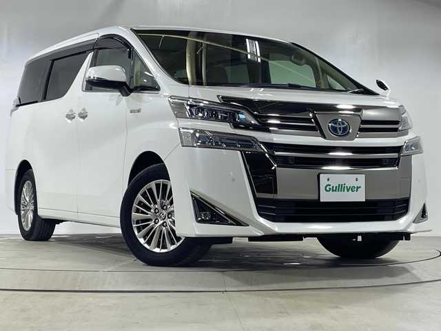 トヨタ ヴェルファイア ハイブリット V Lエディション 神奈川県 2020(令2)年 5万km ホワイトパールクリスタルシャイン 純正9型ディスプレイオーディオ/ツインムーンルーフ/トヨタセーフティセンス/ドライブレコーダー(前後)/車線逸脱警報/バックカメラ/フリップダウンモニター/サンルーフ/レザーシート/両側パワースライドドア/横滑り防止装置/ETC2.0/アイドリングストップ/LEDヘッドライト/フォグランプ/オートライト/ウィンカーミラー/電動格納ミラー/純正17インチAW/シートヒーター/エアシート/シートリフター/ステアリングヒーター/プッシュスタート/スマートキー/フロアマット/保証書/衝突被害軽減ブレーキ/レーントレーシングアシスト/レーダークルーズコントロール/オートマチックハイビーム/緊急時操舵支援