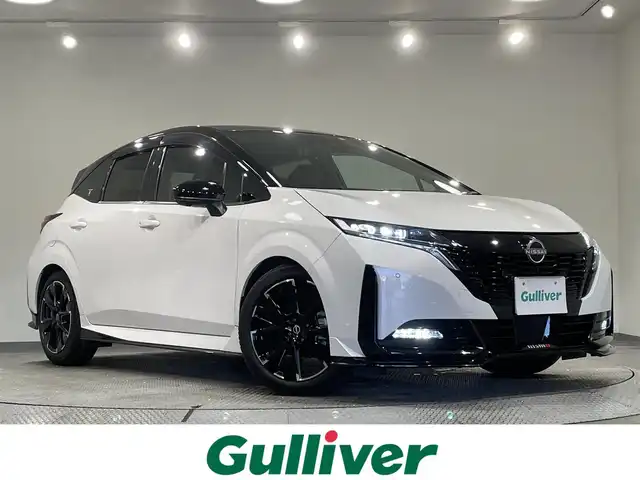日産 オーラ ニスモ 愛知県 2023(令5)年 4.2万km ピュアホワイトパール/スーパーブラック 純正９インチナビ/プロパイロット/アラウンドビューモニター/エマージェンシーブレーキ/ブラインドスポットモニター/車線逸脱警報/クリアランスソナー/電動パーキングブレーキ/ブレーキホールド/ハーフレザー/ハンドルヒーター/シートヒーター/ワイヤレス充電/デジタルインナーミラー/ドライブレコーダー/ビルトインＥＴＣ２．０　/USB＆HDMI入力端子/アクセサリーソケット/ISOFIX/純正フロアマット/純正17インチアルミホイール