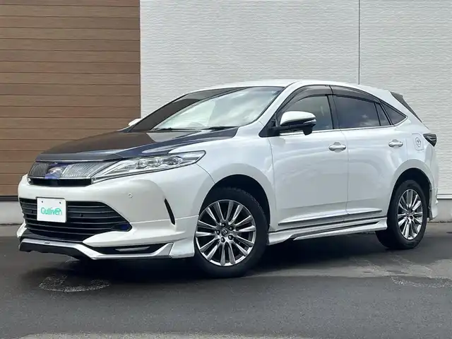 トヨタ ハリアー プレミアム 秋田県 2019(平31)年 16.2万km ホワイトパールクリスタルシャイン ４WD/衝突軽減システム/LEDヘッドライト/モデリスタエアロパーツ/純正メモリナビ（DVD/CD/BT/USB)/フルセグ/バックカメラ/トヨタ純正アルミ（冬タイヤ装着）/スマートキー/純正エンジンスターター/アイドリングストップ/プッシュスタート/コーナーセンサー/クルーズコントロール追従走行有/レーンキープアシスト/アダプティブ・フロントライティングシステム/MTモード付AT/ステアリングスイッチ/運転席パワーシート/ドライブレコーダー/ビルトインETC/電動リアゲート/電動パーキングブレーキ/オートブレーキホールド機能/100V充電/純正フロアマット/純正ドアバイザー/オートライト/オートエアコン/パワーステアリング/パワーウィンドウ/電動格納ウィンカーミラー/横滑り防止/盗難防止装置/寒冷地仕様/保証書/取扱説明書/記録簿