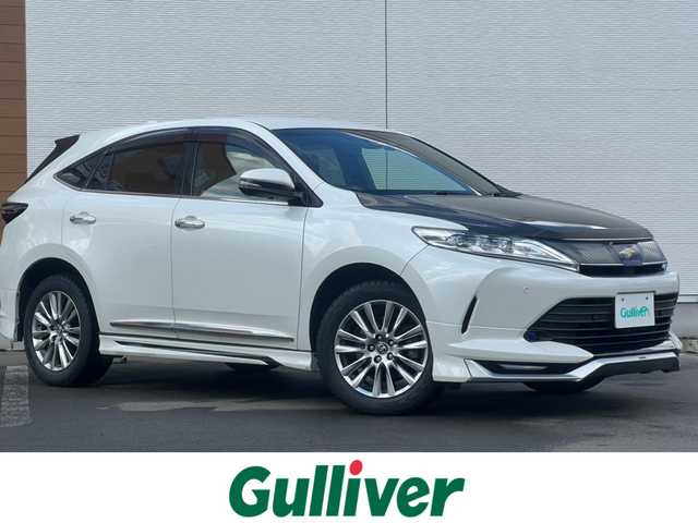 トヨタ ハリアー プレミアム 秋田県 2019(平31)年 16.2万km ホワイトパールクリスタルシャイン ４WD/衝突軽減システム/LEDヘッドライト/モデリスタエアロパーツ/純正メモリナビ（DVD/CD/BT/USB)/フルセグ/バックカメラ/トヨタ純正アルミ（冬タイヤ装着）/スマートキー/純正エンジンスターター/アイドリングストップ/プッシュスタート/コーナーセンサー/クルーズコントロール追従走行有/レーンキープアシスト/アダプティブ・フロントライティングシステム/MTモード付AT/ステアリングスイッチ/運転席パワーシート/ドライブレコーダー/ビルトインETC/電動リアゲート/電動パーキングブレーキ/オートブレーキホールド機能/100V充電/純正フロアマット/純正ドアバイザー/オートライト/オートエアコン/パワーステアリング/パワーウィンドウ/電動格納ウィンカーミラー/横滑り防止/盗難防止装置/寒冷地仕様/保証書/取扱説明書/記録簿