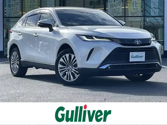 トヨタ ハリアー ハイブリッド Z レザーパッケージ 岡山県 2020(令2)年 8.5万km ホワイトパールクリスタルシャイン 登録時走行距離84240km/JBLプレミアムサウンド/純正12.3インチナビ/フルセグTV(AM.FM.TV.BT)/全方位カメラ/ビルトインETC2.0/トヨタセーフティセンス/・ブラインドスポットモニター/・プリクラッシュセーフティ/・レーダークルーズコントロール/・レーンディバーチャーアラート/D/N席シートヒーター/D/N席ベンチレーション/ステアリングヒーター/クリアランスソナー/横滑り防止装置/アイドリングストップ/パワーバックドア/19インチ純正AW/純正フロアマット/本革シート/D+N席パワーシート