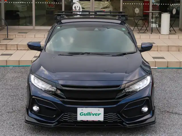 ホンダ シビック ハッチバック 千葉県 2020(令2)年 4.7万km 紺 SEEKERフロントリップスポイラー/モデューロテールゲートスポイラー純正OP/前期型フロントグリル（エンブレムレス加工）/純正グリルあり/HKSリーガマックスプレミアムマフラー/純正マフラーあり/BLITZ車高調ZZR/純正サスあり/YOKOHAMA ADVANREACING RCIII18インチ/純正AWあり/協栄産業ワイトレ11mm/無限シフトノブ/純正シフトノブあり/クレイスミスナンバーフレーム/innoベースキャリア/純正SDナビゲーション/・フルセグTV/・バックカメラ/・Bluetooth/・CD/DVD再生/ビルトインETC2.0/純正ドライブレコーダー（前後）/純正フロアマット/ホンダセンシング/・衝突軽減ブレーキ/・アダクティブクルーズコントロール/・歩行者事故低減ステアリング/・路外逸脱抑制機能/・渋滞追従機能付/・車線維持支援システム/・先行車発進お知らせ機能/・オートハイビーム/・標識認識機能/・革コンビシート/パワーシート（D/N席）/シートヒーター（D/N席）/プッシュスタート/電子パーキングブレーキ/ブレーキホールド/保証書/取扱説明書/スペアキー