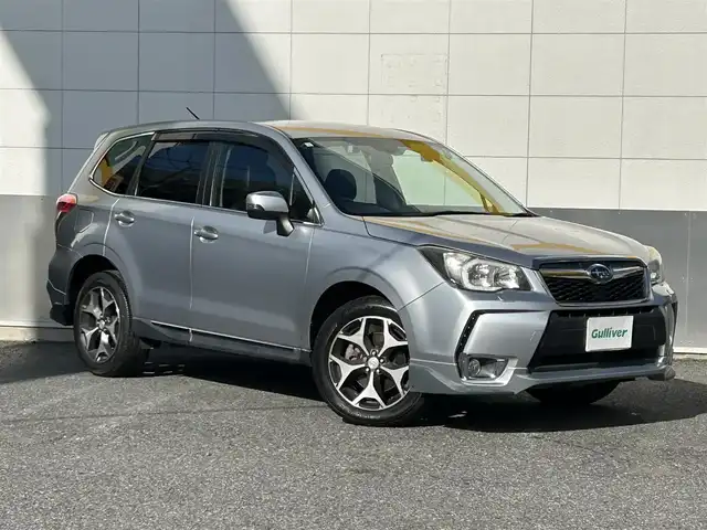 スバル フォレスター 2．0XT アイサイト 東京都 2012(平24)年 10.6万km アイスシルバーメタリック 純正フルエアロ/社外メモリーナビ/　DVD/CD/Bluetooth/全車速追従機能付クルーズコントロール/プリクラッシュブレーキ/先行車発進お知らせ/AT誤発進抑制/ふらつき警報/車線逸脱警報/前後ドライブレコーダー/ハーフレザーシート/パワーシート/シートヒーター/HIDヘッドライト/フォグランプ/オートライト/ETC/純正18インチアルミホイール/革巻きステアリングホイール/ステアリングスイッチ/パドルシフト/プッシュスタート/スマートキー/電動格納ミラー/ウインカーミラー/横すべり防止/フロアマット/ドアバイザー/取扱説明書/スペアキー