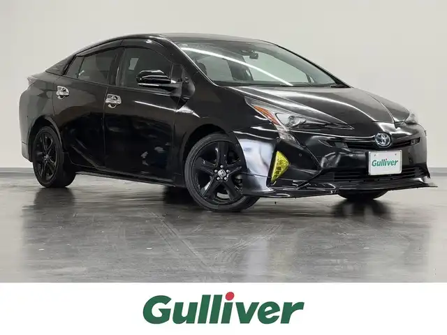 トヨタ プリウス A プレミアム　ツーリングセレ 三重県 2018(平30)年 6.7万km アティチュードブラックマイカ ハイブリッド/FF/インパネCVT/純正 11.6インチ 縦型ナビ*/（AM/FM/USB/iPod/Bluetooth/AUX/TV）/バックカメラ*/純正エアロ（F/S/R下）/ETC2.0*/Toyota Safety Sense/・プリクラッシュセーフティ/・レーンディパーチャーアラート（操舵支援付）/・レーダークルコン/・オートハイビーム/・ふらつき検知機能/・ブラインドスポットモニター/・インテリジェントクリアランスソナー（巻き込み警報機能付）/・シンプルインテリジェントパーキングアシスト/など/装備/・本革シート/・シートヒーター（D/N）/・パワーシート（Dランバーサポート付8way）/・ステアリングヒーター/・カラーヘッドアップディスプレイ/・AC100Vアクセサリーコンセント（ヴィークルパワーコネクター付・V2H対応・コンセント2ヶ）/・オートエアコン/・オートライト/・LEDヘッドライト＆フロントフォグランプ/・【OP】純正17inAW/・ステアリングスイッチ*/・プッシュスタート/・スマートキーx2/・保/取/ナビ取/・【DOP】マイナスイオン発生機能付LEDルームライト/など/*1…【OP】ナビレディセット