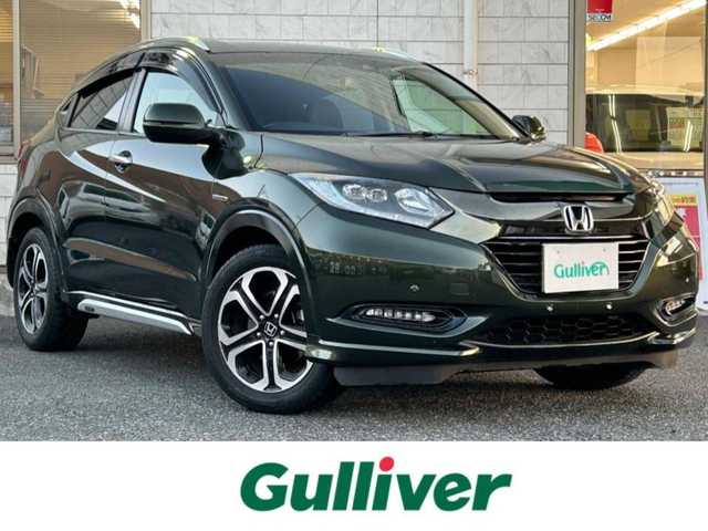 ホンダ ヴェゼル ハイブリッド Z ホンダセンシング 福岡県 2017(平29)年 8.4万km ミスティックグリーンパール ワンオーナー/純正8インチナビ【VXM-175VFEi】/　(AM/FM/CD/DVD/Bluetooth/フルセグTV)/バックカメラ/ホンダセンシング/・衝突軽減ブレーキ/・先行車発信お知らせ機能/・車両接近通報/・歩行者事故低減ステアリング/・路外逸脱抑制/・標識認識/・アダプティブクルーズコントロール/・車線維持支援/・パーキングセンサー/横滑り防止/オートマチックブレーキホールド/純正17インチアルミホイール/ルーフレール/黒色ハーフレザーシート/ビルトインETC/パドルシフト/革巻きステアリング/ステアリングスイッチ/シートヒーター(D/N)/純正フロアマット/フロントガラス熱線/USBポート/アクセサリーソケット/保証書/取扱説明書/ナビ取扱説明書