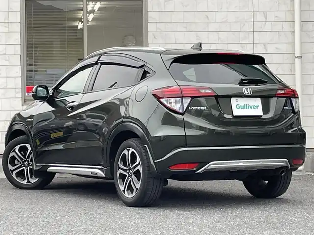 ホンダ ヴェゼル ハイブリッド Z ホンダセンシング 福岡県 2017(平29)年 8.4万km ミスティックグリーンパール ワンオーナー/純正8インチナビ【VXM-175VFEi】/　(AM/FM/CD/DVD/Bluetooth/フルセグTV)/バックカメラ/ホンダセンシング/・衝突軽減ブレーキ/・先行車発信お知らせ機能/・車両接近通報/・歩行者事故低減ステアリング/・路外逸脱抑制/・標識認識/・アダプティブクルーズコントロール/・車線維持支援/・パーキングセンサー/横滑り防止/オートマチックブレーキホールド/純正17インチアルミホイール/ルーフレール/黒色ハーフレザーシート/ビルトインETC/パドルシフト/革巻きステアリング/ステアリングスイッチ/シートヒーター(D/N)/純正フロアマット/フロントガラス熱線/USBポート/アクセサリーソケット/保証書/取扱説明書/ナビ取扱説明書