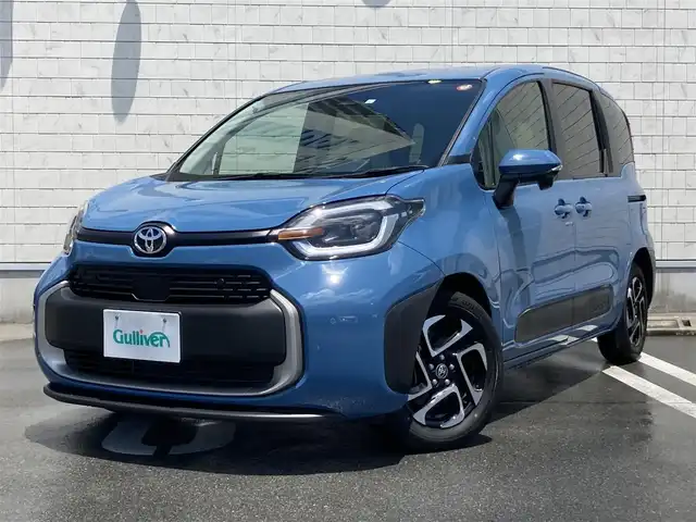 トヨタ シエンタ Z 静岡県 2023(令5)年 1.3万km グレイッシュブルー Toyota Safety Sense/純正8インチナビ/　AM FM Bluetooth USB AppleCarPlay AndroidAuto/LEDオートヘッドランプ/レーダークルーズコントロール/シートヒーター(前席)/ステアリングヒーター/両側パワースライドドア/純正15インチアルミホイール/ホワイトレザー調シートカバー(1.2列目)/リアサンシェード/スマートキー2本/MTモード付AT/ビルトインETC2.0/バックモニター