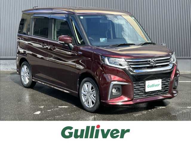 スズキ ソリオ HV MZ 福島県 2024(令6)年 0.4万km メロウディープレッドパール 純正9inメモリナビ/　【フルセグ/CD/DVD/USB/BT/ipod】/デュアルカメラブレーキサポート/バックカメラ/全周囲カメラ/ビルトインETC/ステアリングスイッチ/レーダークルーズコントロール/ヘッドアップディスプレイ/前席シートヒーター/両側パワースライドドア/アイドリングストップ/横滑り防止機能/パーキングアシスト/レーンキープアシスト/LEDライト（AUTO機能付き）/　・フォグランプ/衝突軽減システム/純正フロアマット/純正ドアバイザー/リアサーキュレーター/リアサンシェード/シートバックテーブル/コーナーセンサー