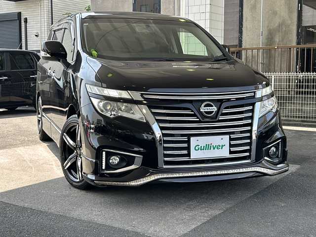 日産 エルグランド 250ハイウェイスター 京都府 2014(平26)年 8.3万km ファントムブラック PanasonicSDナビ/（フローティングナビ　CN-F1DVD）　/フルセグTV/FM/AM/Bluetooth/CD/DVD/USB/SDミュージックサーバー/純正フリップダウンモニター/外19インチＡＷ/　ESTATUS/Style-CTRGloss Black/両側パワースライドドア/パワーバックドア/バックカメラ/3列シート/オットマン/ウォークスルー/クルーズコントロール/ビルトインETC/WAC/LEDライト/オートライト/禁煙車