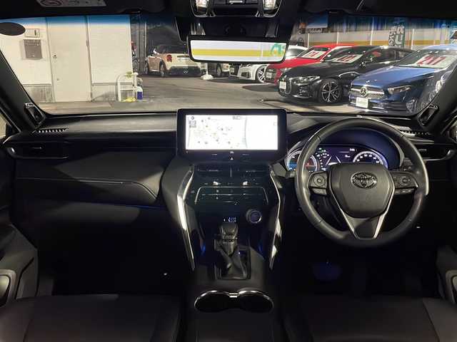 トヨタ ハリアー ハイブリッド Z 愛知県 2021(令3)年 1.2万km ホワイトパールクリスタルシャイン /禁煙//ワンオーナー//モデリスタフルエアロ//メーカーオプションナビ//AM/FM/USB/AUX/BT/フルセグ//Miracast//JBLプレミアムサウンド//PCS/ACC/AHB/RSA/LTA//PKSB/RCTA/BSM/HUD//クリアランスソナー//ビルトインETC2.0//パノラミックビューモニター//デジタルインナーミラー//オートLEDライト//フォグランプ//ハーフレザーシート//D席パワーシート//本革巻きステアリング//ステアリングリモコン//オートリトラクラブルウィンカーミラー//電動パーキングブレーキ//AUTO HOLD//MT付きAT//パワーバックドア//電動チルト＆テレスコピック//スペアタイヤ//EV MODE//DRIVE MODE//ECO/NORMAL/SPORT//横滑り防止装置//プッシュスタート//スマートキー//スペアキー//ISOFIX//純正フロアマット//ドアバイザー//トノカバー//照明付きバニティミラー//保証書//取扱説明書//ナビ取扱説明書//R3-6年記録簿