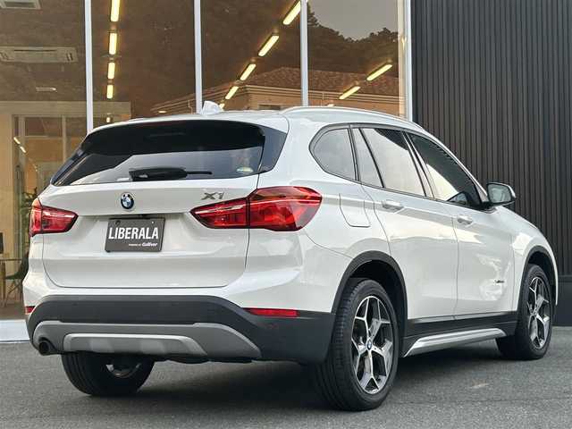 ＢＭＷ Ｘ１ xDrive 18d xライン 福岡県 2017(平29)年 6.4万km アルピンホワイトⅢ インテリジェントセーフティ/ハーフレザーシート/シートヒーター/純正ナビ　/バックカメラ/Bluetooth/パワーバックドア/オートライト　/フロントフォグランプ/リアフォグランプ　/ステアリングスイッチ/社外レーダー探知機　/純正１８インチアルミホイール/ミラー一体型ETC