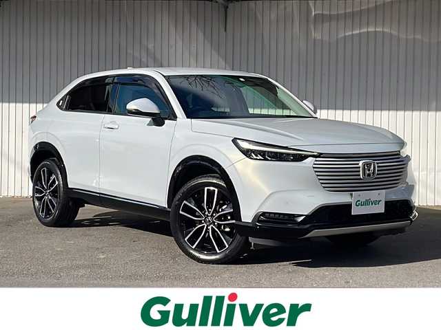 ホンダ ヴェゼル ハイブリッド 長野県 2023(令5)年 3.2万km プレミアムサンライトホワイトパール 純正メーカーナビフルセグＴＶ/バックカメラ/ＥＴＣ２．０/パワーバックドア/ハーフレザーシート/シートヒーター/ステアリングヒーター/純正１８インチアルミ/レーダークルーズコントロール/パーキングセンサー/保証書/スペアキー