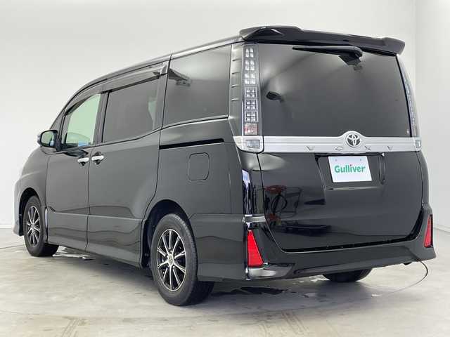 トヨタ ヴォクシー ZS 煌 新潟県 2015(平27)年 8.2万km ブラック 純正9インチディーラーOPナビ（NSZT-Y64T）/　・バックカメラ/　・フルセグTV/　・Bluetooth/　・DVD/SD/CD再生機能/ビルトインETC/両側パワースライドドア/オートライト/オートドアミラー/ウィンカーミラー/社外15インチアルミホイール/純正フロアマット/純正ドアバイザー/アイドリングストップ/プッシュスタート