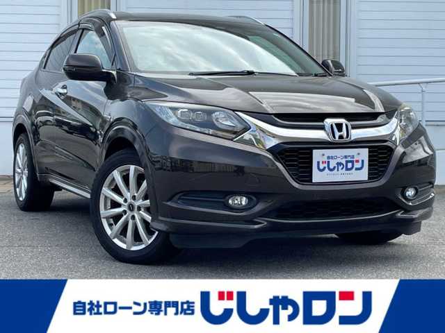 ホンダ ヴェゼル ハイブリッド Z 富山県 2015(平27)年 11.5万km ゴールドブラウンM (株)IDOMが運営する【じしゃロン富山店】の自社ローン専用車両になります。こちらは現金またはオートローンご利用時の価格です。自社ローンご希望の方は別途その旨お申し付け下さい/ブレーキホールド/電動パーキング/バックカメラ/クルーズコントロール/フルセグTV