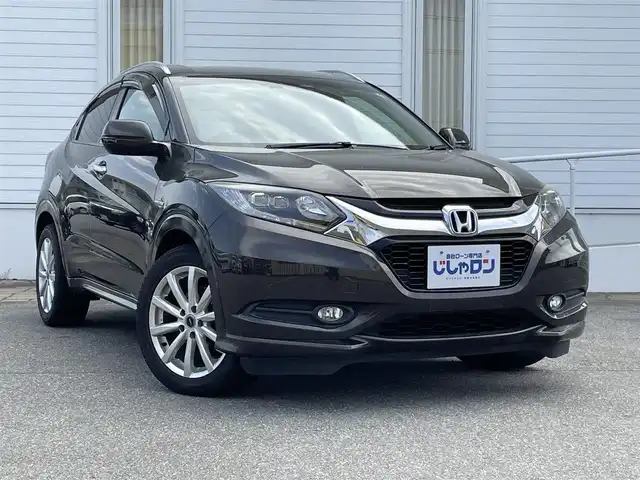 ホンダ ヴェゼル ハイブリッド Z 富山県 2015(平27)年 11.5万km ゴールドブラウンM (株)IDOMが運営する【じしゃロン富山店】の自社ローン専用車両になります。こちらは現金またはオートローンご利用時の価格です。自社ローンご希望の方は別途その旨お申し付け下さい/ブレーキホールド/電動パーキング/バックカメラ/クルーズコントロール/フルセグTV
