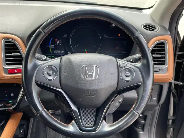 ホンダ ヴェゼル ハイブリッド Z 富山県 2015(平27)年 11.5万km ゴールドブラウンM (株)IDOMが運営する【じしゃロン富山店】の自社ローン専用車両になります。こちらは現金またはオートローンご利用時の価格です。自社ローンご希望の方は別途その旨お申し付け下さい/ブレーキホールド/電動パーキング/バックカメラ/クルーズコントロール/フルセグTV