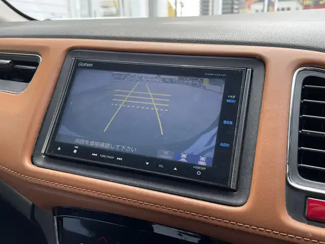 ホンダ ヴェゼル ハイブリッド Z 富山県 2015(平27)年 11.5万km ゴールドブラウンM (株)IDOMが運営する【じしゃロン富山店】の自社ローン専用車両になります。こちらは現金またはオートローンご利用時の価格です。自社ローンご希望の方は別途その旨お申し付け下さい/ブレーキホールド/電動パーキング/バックカメラ/クルーズコントロール/フルセグTV