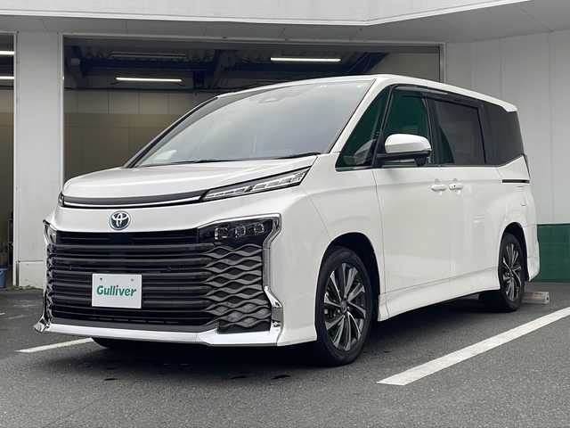 トヨタ ヴォクシー ハイブリッド S－Z 京都府 2022(令4)年 6.7万km ホワイトパールクリスタルシャイン 純正１０．５インチディスプレイオーディオ　ナビ　ＤＶＤ再生　Ｂｌｕｅｔｏｏｔｈオーディオ　フリップダウンモニター　両側パワースライドドア　ＬＥＤヘッドライト　ビルトインＥＴＣ　レーダークルーズ