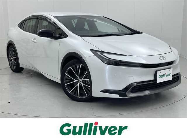 トヨタ プリウス Z 茨城県 2023(令5)年 1.5万km プラチナホワイトパールマイカ 純正12.3型DA/・ナビ機能あり(未更新)/全周囲カメラ/フルセグ/AC100V/ワイヤレス充電器 /アドバンストパーク/衝突被害軽減ブレーキ/車線逸脱抑制装置/レーダークルーズコントロール/オートマチックハイビーム/クリアランスソナー/BSM/ETC2.0/ドラレコ/シートヒーター/ベンチレーション/ステアリングヒーター/純正19インチAW/LEDヘッドライト/スマートキー