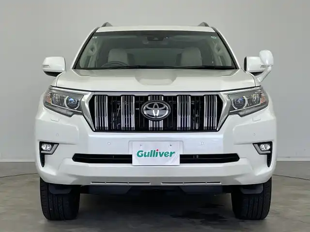 トヨタ ランドクルーザー プラド TX Lパッケージ 新潟県 2023(令5)年 1.1万km ホワイトパールクリスタルシャイン 4WD/寒冷地仕様/サンルーフ/7人乗り/純正メモリナビ【NSCN-W68】/　ワンセグTV/Bluetooth/CD/レーダークルーズコントロール/衝突被害軽減ブレーキ/レーンキープアシスト/前後コーナーセンサー/レザーシート/前席パワーシート/前席シートヒーター/前席エアシート/バックモニター/ビルトインETC/オートマチックハイビーム/LEDヘッドライト/横滑り防止装置/オートライト/レザーステアリング/ステアリングスイッチ/禁煙車