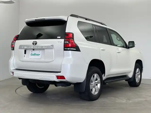 トヨタ ランドクルーザー プラド TX Lパッケージ 新潟県 2023(令5)年 1.1万km ホワイトパールクリスタルシャイン 4WD/寒冷地仕様/サンルーフ/7人乗り/純正メモリナビ【NSCN-W68】/　ワンセグTV/Bluetooth/CD/レーダークルーズコントロール/衝突被害軽減ブレーキ/レーンキープアシスト/前後コーナーセンサー/レザーシート/前席パワーシート/前席シートヒーター/前席エアシート/バックモニター/ビルトインETC/オートマチックハイビーム/LEDヘッドライト/横滑り防止装置/オートライト/レザーステアリング/ステアリングスイッチ/禁煙車