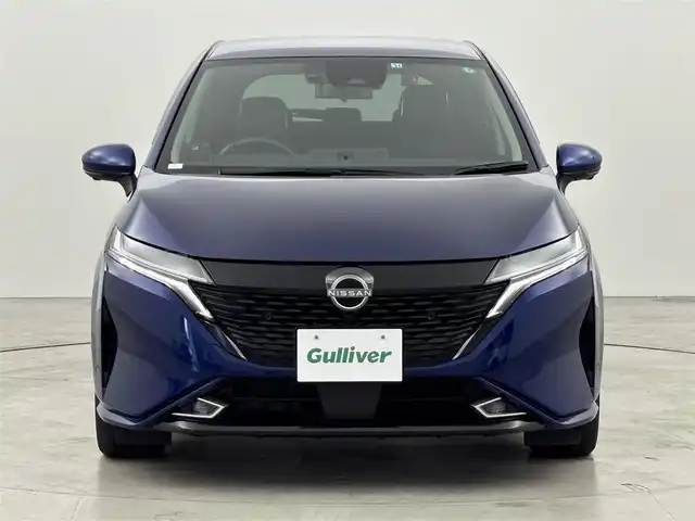 日産 オーラ G レザーエディション 福岡県 2022(令4)年 4.4万km オーロラフレアブルーパール 純正９型ナビ／フルセグＴＶ　/全方位カメラ　/ＢＯＳＥプレミアムサウンド　/ワイヤレス充電　/デジタルルームミラー　/前後ドライブレコーダー　/ＥＴＣ　/レーダー探知機　/エマージェンシーブレーキ　/レーンキープ　/ＢＳＭ　/ステアリングヒーター　/シートヒーター