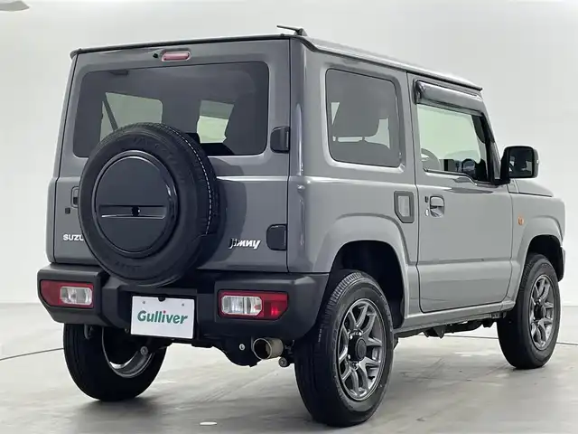スズキ ジムニー XC 福井県 2023(令5)年 1.4万km ミディアムグレー 4WD/スズキセーフティサポート/ロッソモデロマフラー/社外フューエルリッド/IPFフォグランプ/クルーズコントロール/社外メモリナビ/-フルセグTVCD/DVD/Bluetooth/バックカメラ/ドライブレコーダー/ドアバイザー/フロアマット/前席シートヒーター/純正１６インチAW/プッシュスタート/スマートキー