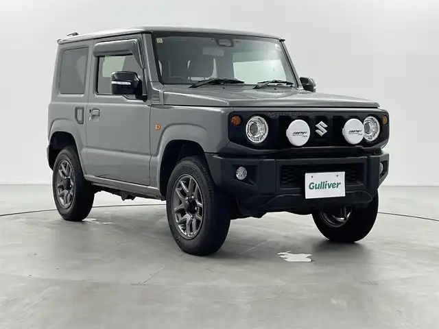 スズキ ジムニー XC 福井県 2023(令5)年 1.4万km ミディアムグレー 4WD/スズキセーフティサポート/ロッソモデロマフラー/社外フューエルリッド/IPFフォグランプ/クルーズコントロール/社外メモリナビ/-フルセグTVCD/DVD/Bluetooth/バックカメラ/ドライブレコーダー/ドアバイザー/フロアマット/前席シートヒーター/純正１６インチAW/プッシュスタート/スマートキー
