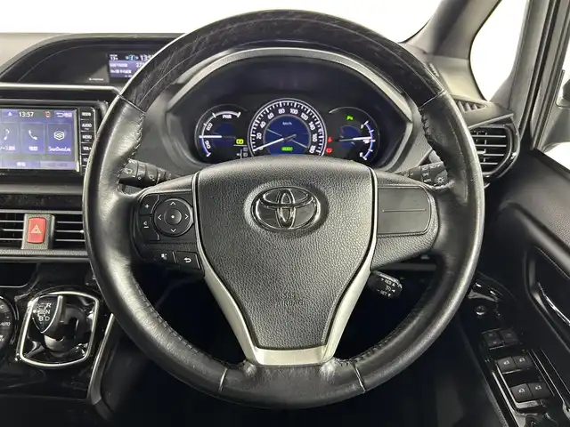 トヨタ エスクァイア ハイブリッド Gi 佐賀県 2019(令1)年 3.4万km ブラック ディーラー純正ワイドナビ/フルセグTV/Bluetooth/FM/AM/バックカメラ/合皮シート/シートヒーター/Wオートエアコン/両側パワースライドドア/ビルトインETC/コーナーセンサー/メーカーオプションサウンドスピーカー/革巻きステアリング/トヨタセーフティセンス/PCS・２DA/オートマチックハイビーム/クルーズコントロール