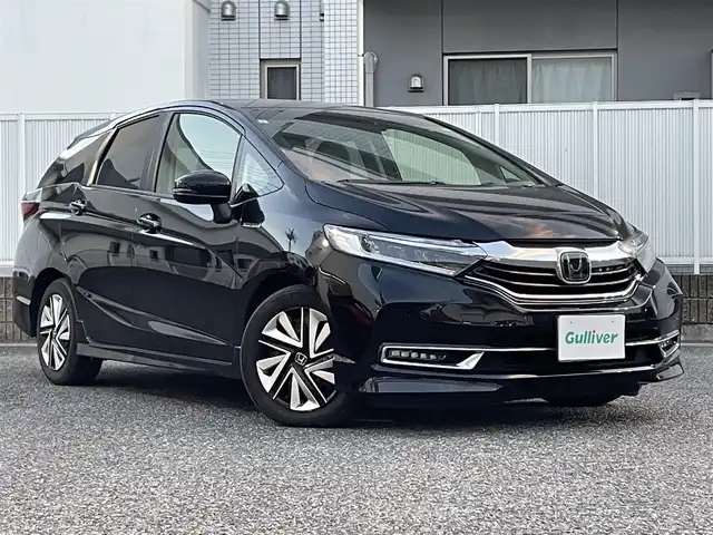 ホンダ シャトル ハイブリッド X ホンダセンシング 愛知県 2019(令1)年 3.1万km クリスタルブラックパール Gathersナビ（フルセグ、CD、DVD、AM、FM、BT）/バックカメラ/プッシュスタート/レーダークルーズコントロール/パドルシフト/ビルトインETC/ステアリングリモコン/ハーフレザーシート/シートヒーター（DN）/オートライト/電格ウィンカーミラー/横滑り防止/衝突軽減システム/路外逸脱抑制システム/スペアキー/取扱説明書/ナビ取扱説明書/保証書