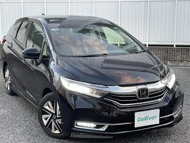 ホンダ シャトル ハイブリッド X ホンダセンシング 愛知県 2019(令1)年 3.1万km クリスタルブラックパール Gathersナビ（フルセグ、CD、DVD、AM、FM、BT）/バックカメラ/プッシュスタート/レーダークルーズコントロール/パドルシフト/ビルトインETC/ステアリングリモコン/ハーフレザーシート/シートヒーター（DN）/オートライト/電格ウィンカーミラー/横滑り防止/衝突軽減システム/路外逸脱抑制システム/スペアキー/取扱説明書/ナビ取扱説明書/保証書