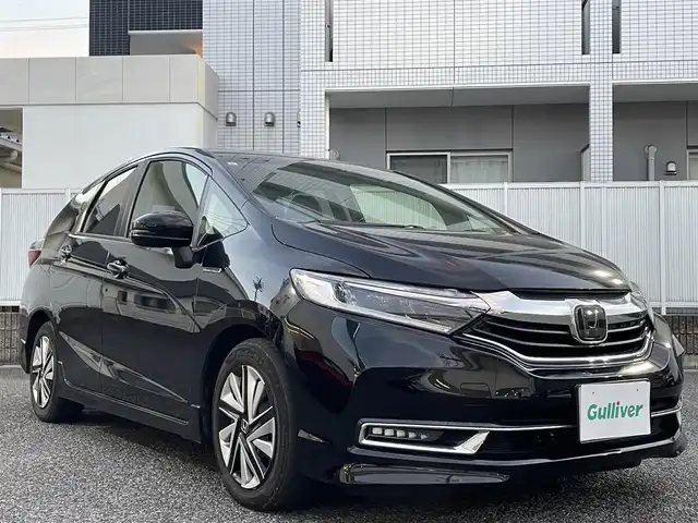 ホンダ シャトル ハイブリッド X ホンダセンシング 愛知県 2019(令1)年 3.1万km クリスタルブラックパール Gathersナビ（フルセグ、CD、DVD、AM、FM、BT）/バックカメラ/プッシュスタート/レーダークルーズコントロール/パドルシフト/ビルトインETC/ステアリングリモコン/ハーフレザーシート/シートヒーター（DN）/オートライト/電格ウィンカーミラー/横滑り防止/衝突軽減システム/路外逸脱抑制システム/スペアキー/取扱説明書/ナビ取扱説明書/保証書