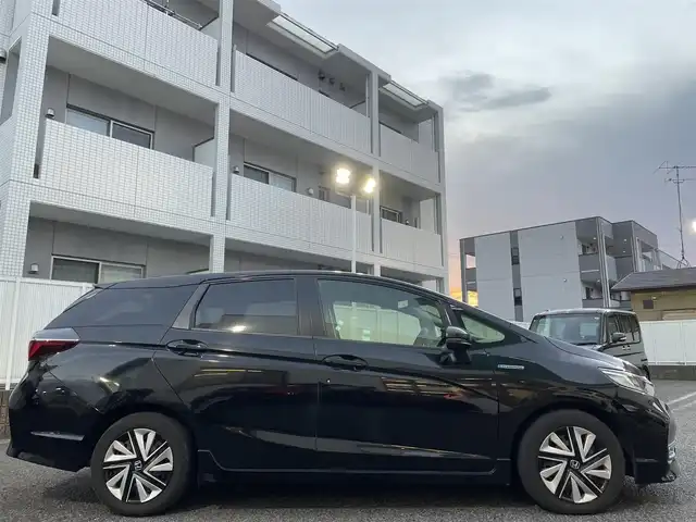 ホンダ シャトル ハイブリッド X ホンダセンシング 愛知県 2019(令1)年 3.1万km クリスタルブラックパール Gathersナビ（フルセグ、CD、DVD、AM、FM、BT）/バックカメラ/プッシュスタート/レーダークルーズコントロール/パドルシフト/ビルトインETC/ステアリングリモコン/ハーフレザーシート/シートヒーター（DN）/オートライト/電格ウィンカーミラー/横滑り防止/衝突軽減システム/路外逸脱抑制システム/スペアキー/取扱説明書/ナビ取扱説明書/保証書