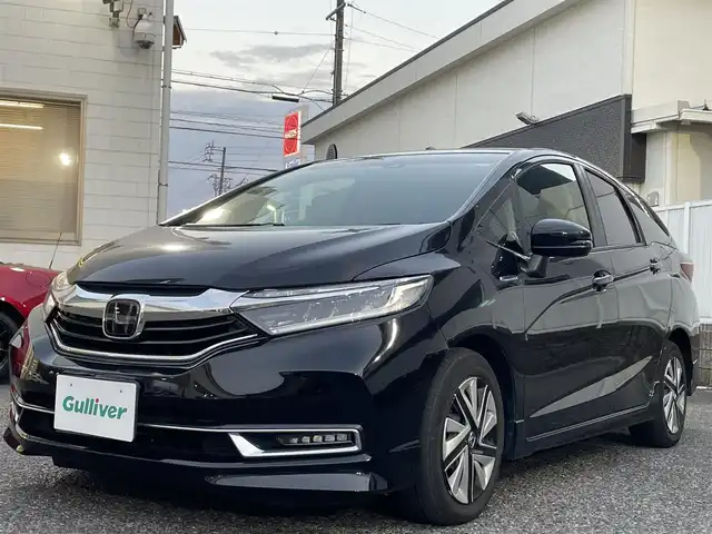 ホンダ シャトル ハイブリッド X ホンダセンシング 愛知県 2019(令1)年 3.1万km クリスタルブラックパール Gathersナビ（フルセグ、CD、DVD、AM、FM、BT）/バックカメラ/プッシュスタート/レーダークルーズコントロール/パドルシフト/ビルトインETC/ステアリングリモコン/ハーフレザーシート/シートヒーター（DN）/オートライト/電格ウィンカーミラー/横滑り防止/衝突軽減システム/路外逸脱抑制システム/スペアキー/取扱説明書/ナビ取扱説明書/保証書